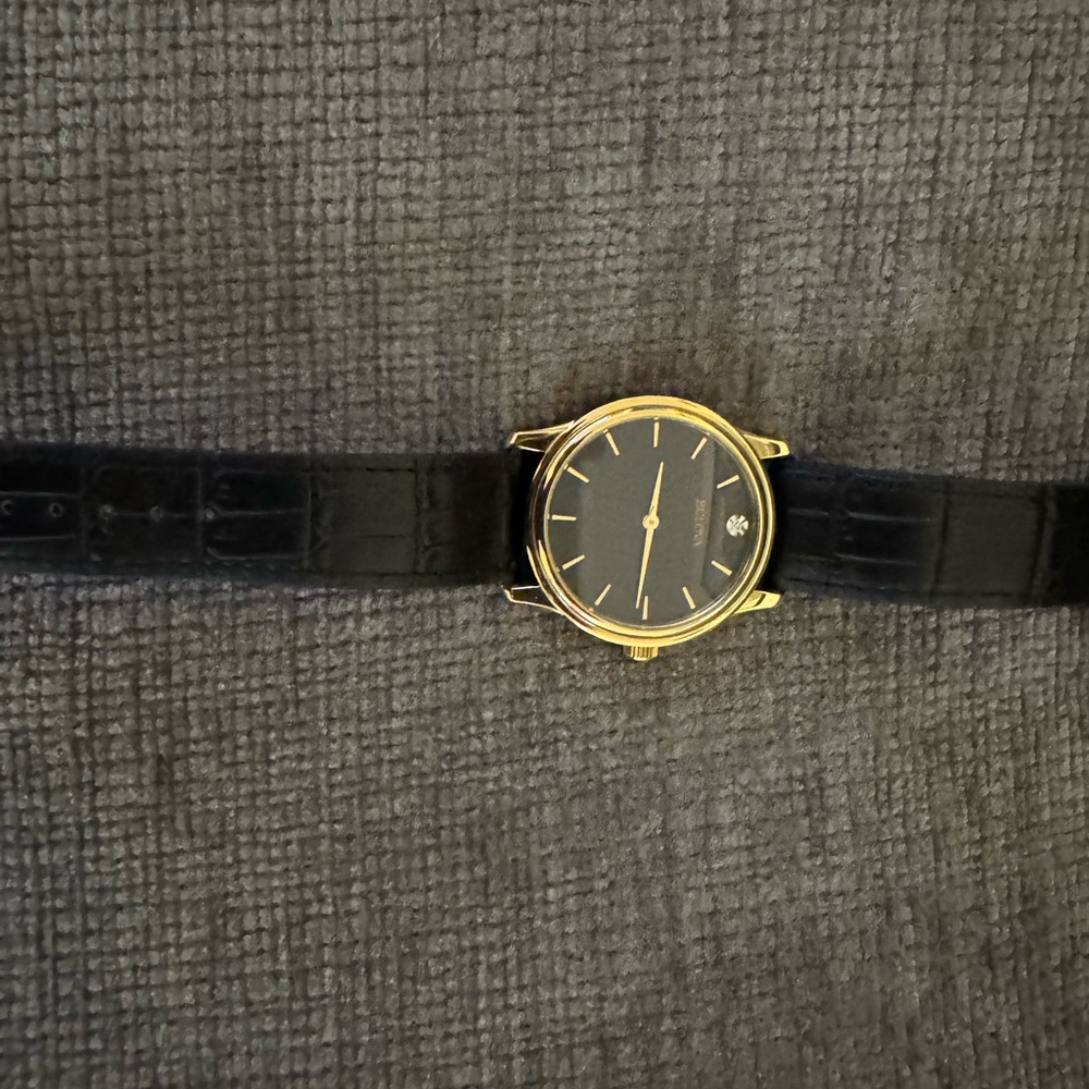 Bulova Men’s Quartz Diamond Accent Black Dial gold case watch 38mm